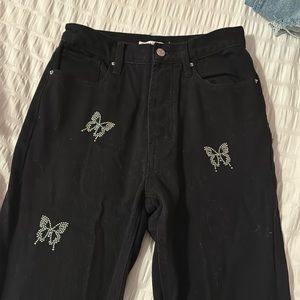 black pacsun jeans with butterfly gems